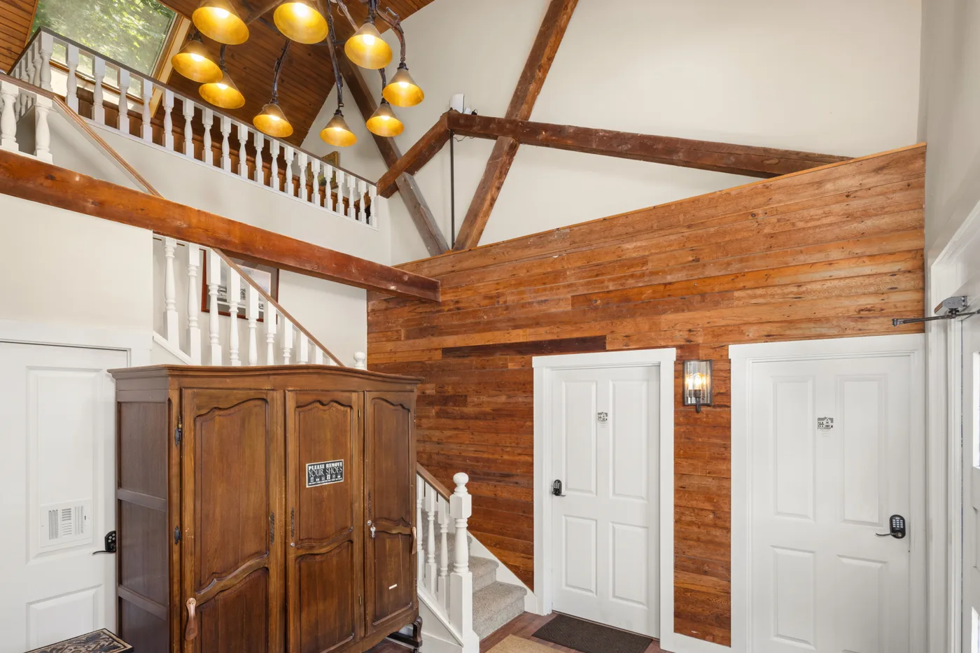 Carriage House foyer — dedicated guest entrance with custom lighting
